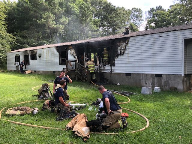 Flames damage Roopville house